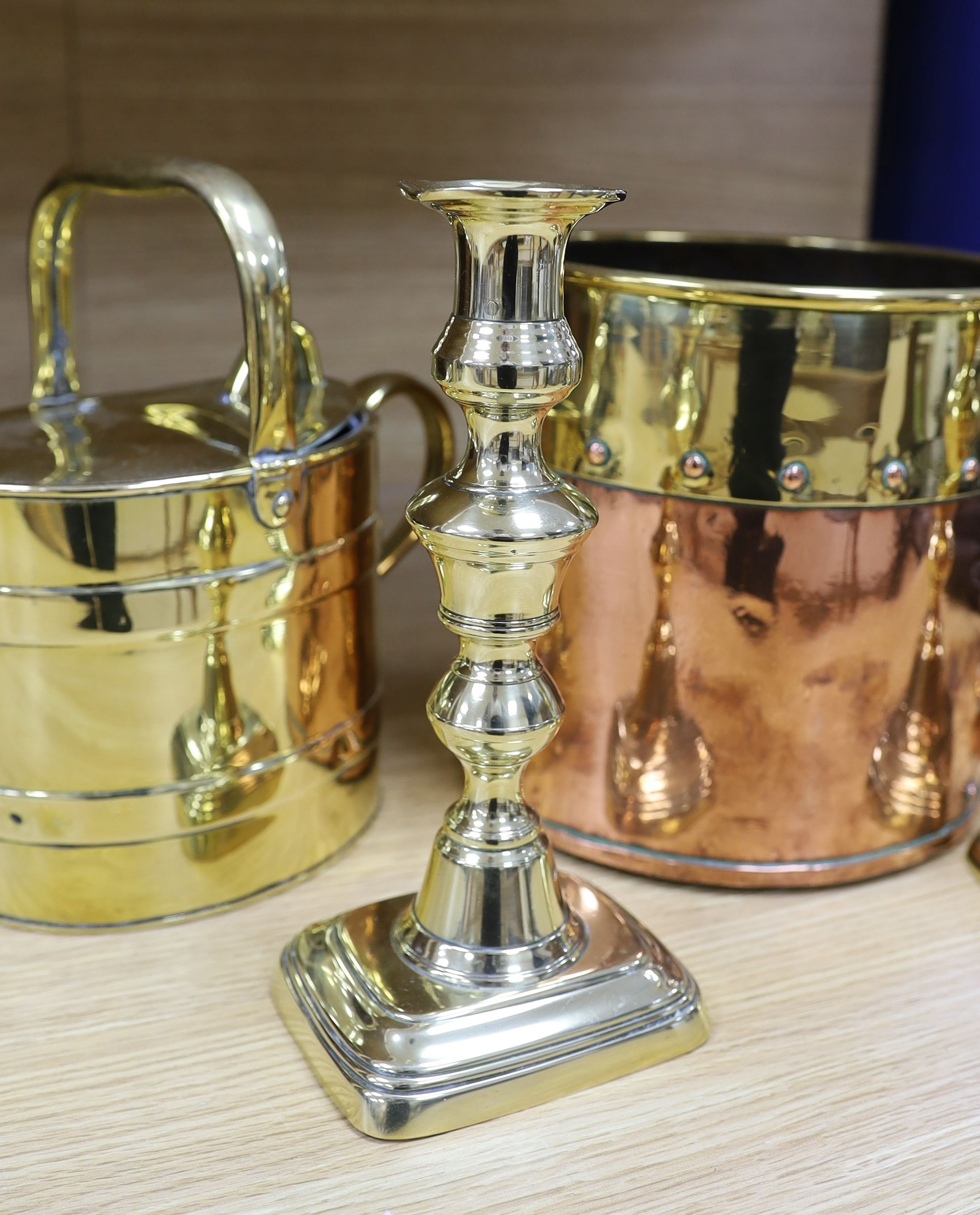 A Victorian copper jelly mould, pair of Victorian brass candlesticks 23cm, a brass water kettle, and a brass copper jardinière